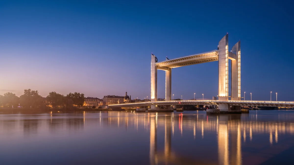 A van with a driver crossing the Chaban-Delmas Bridge in Bordeaux