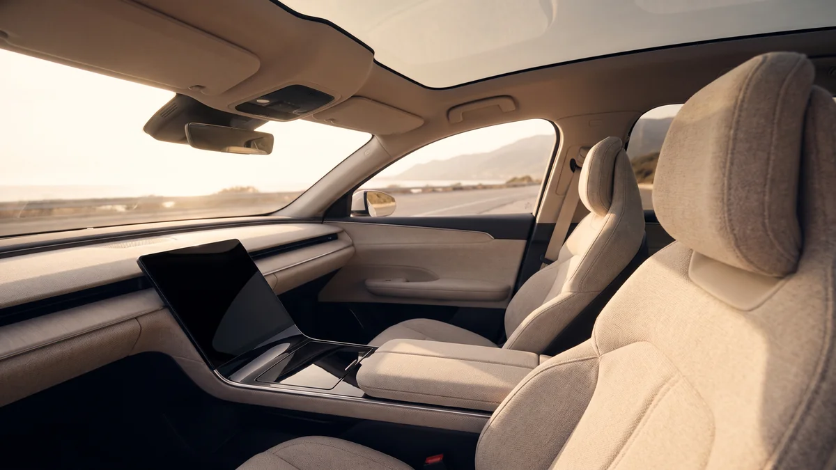The modern, minimalist interior of a chauffeur-driven electric sedan in Bordeaux